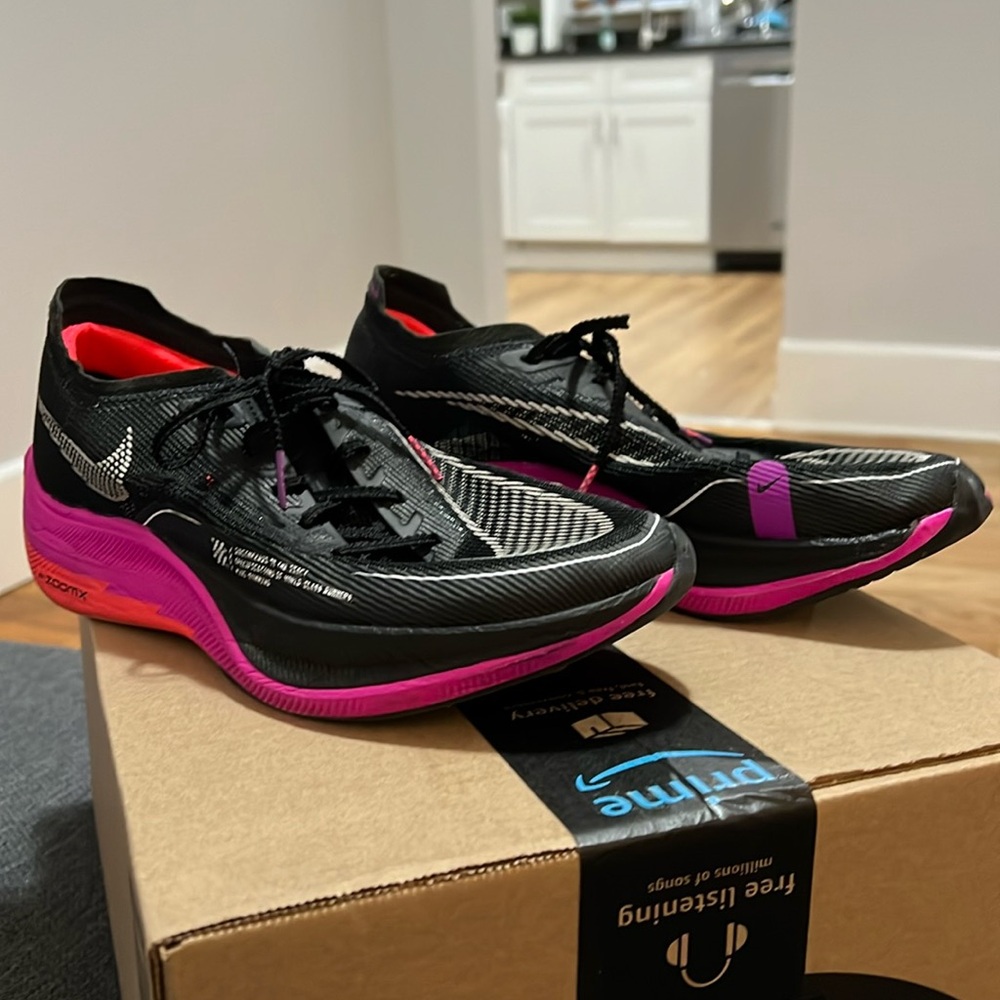 Size 9 Nike Vaporfly 2. Worn in 2 races. Some cosmetic wear on sole of shoe.